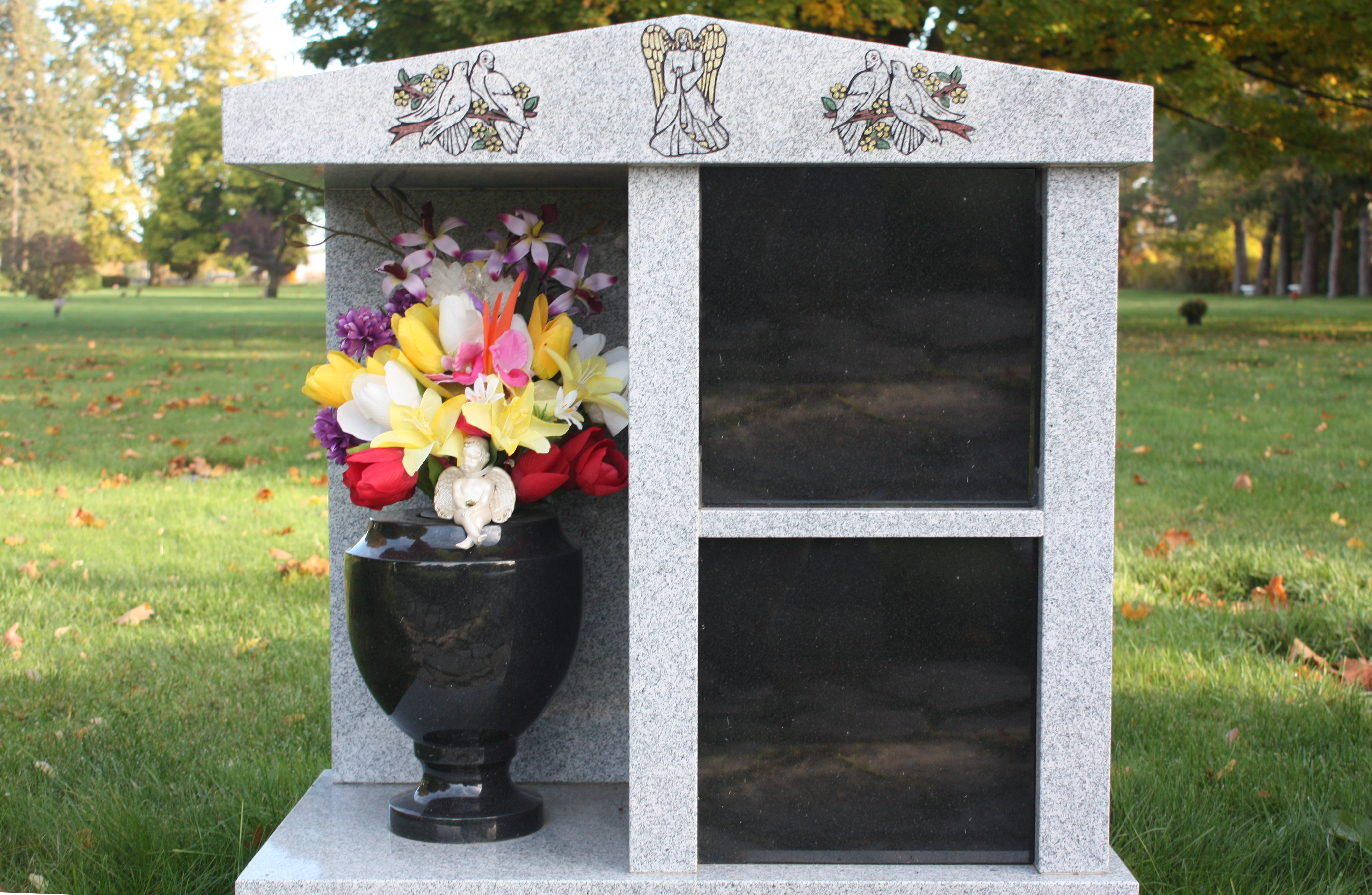 A two niche columbarium with vase.